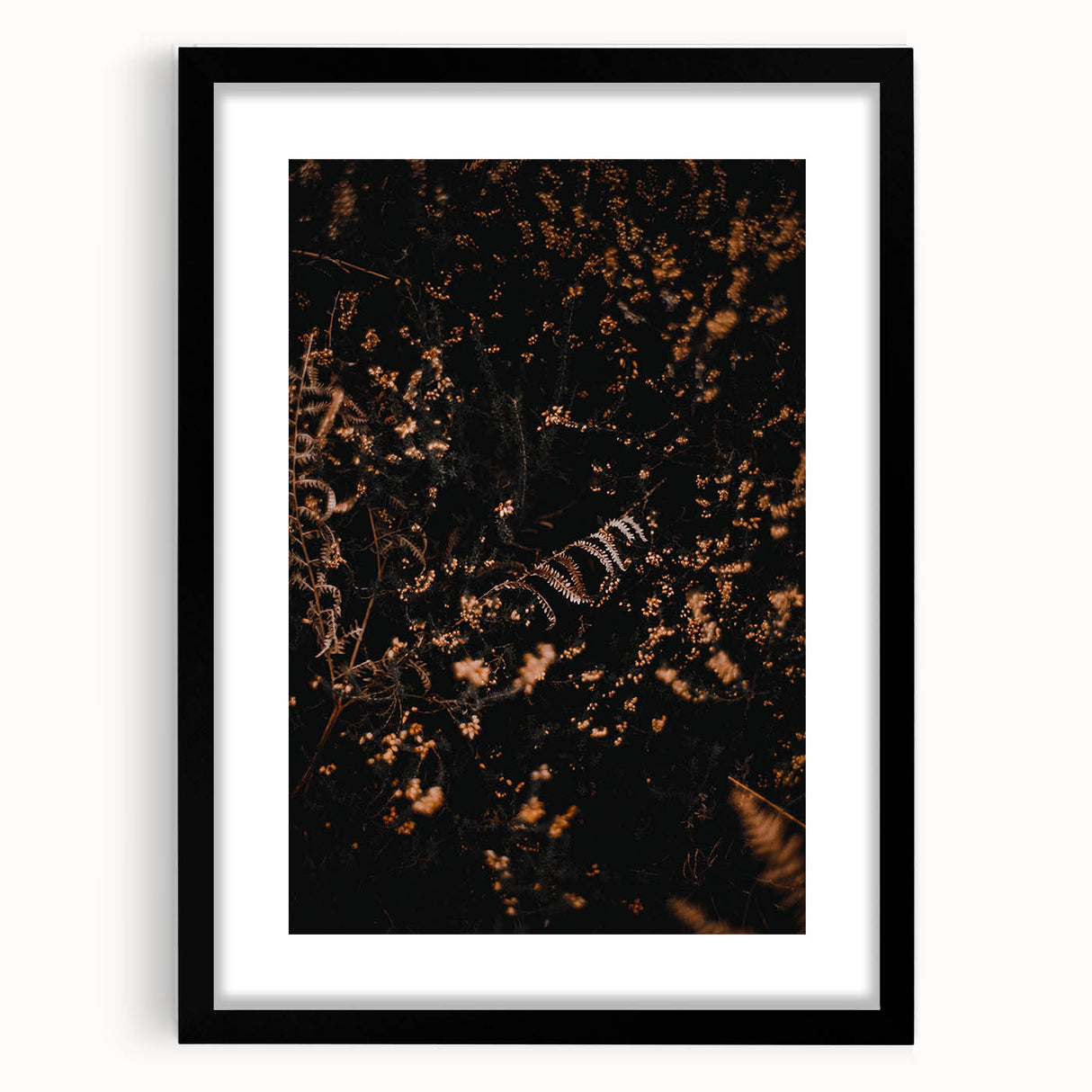 Extra large abstract art print featuring textured fall foliage in vibrant reds and oranges, framed in black.