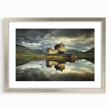 Elegant silver-framed landscape artwork depicting a castle surrounded by lush greenery, with a white mat accentuating the piece, ideal for home decor.