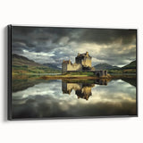 Framed canvas artwork showcasing a scenic landscape with a majestic castle, set against a vibrant blue sky, featuring a sleek black frame for a modern touch.