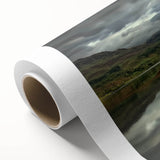 Rolled canvas showcasing a vibrant landscape featuring a majestic castle amidst lush greenery, designed for wall decor. Perfectly packaged in a protective cardboard tube for shipping.