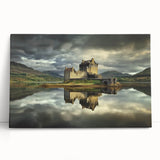 Stretched canvas artwork depicting a serene landscape with a majestic castle surrounded by lush greenery under a clear blue sky, ideal for home decor.