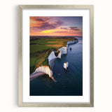 Framed landscape artwork featuring dramatic cliffs, silver matting, and a sleek modern design, perfect for enhancing home decor with nature-inspired elegance.