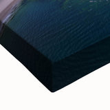 Close-up of a stretched canvas artwork depicting a dramatic cliff landscape, showcasing rich colors and intricate details, ideal for home decor enthusiasts.