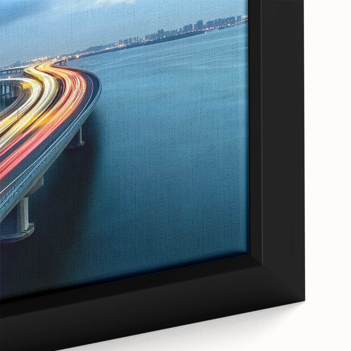 Close-up of a framed landscape canvas print showcasing a serene bridge scene over a tranquil river, with vibrant colors and detailed textures that enhance the visual appeal. Ideal for home decor, this artwork adds a touch of nature-inspired elegance to any space.