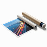Landscape bridge rolled print showcasing a serene sunset over a picturesque bridge, featuring vibrant oranges and blues, packaged securely for easy display and protection.
