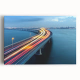 Stretched canvas artwork of a serene landscape featuring a picturesque bridge over a tranquil river, surrounded by lush greenery and vibrant flowers, perfect for home decor.