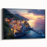 Framed canvas artwork depicting a serene countryside landscape with rolling hills, lush greenery, and a vibrant sunset, presented in a sleek black frame, perfect for home decor.