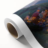 Rolled canvas showcasing a serene countryside landscape, featuring lush green fields and distant hills under a bright blue sky, elegantly packaged in a protective tube.