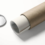 Vibrant rolled canvas showcasing a serene landscape of lush green fields under a clear blue sky, elegantly packaged in a protective cardboard tube for safe delivery.