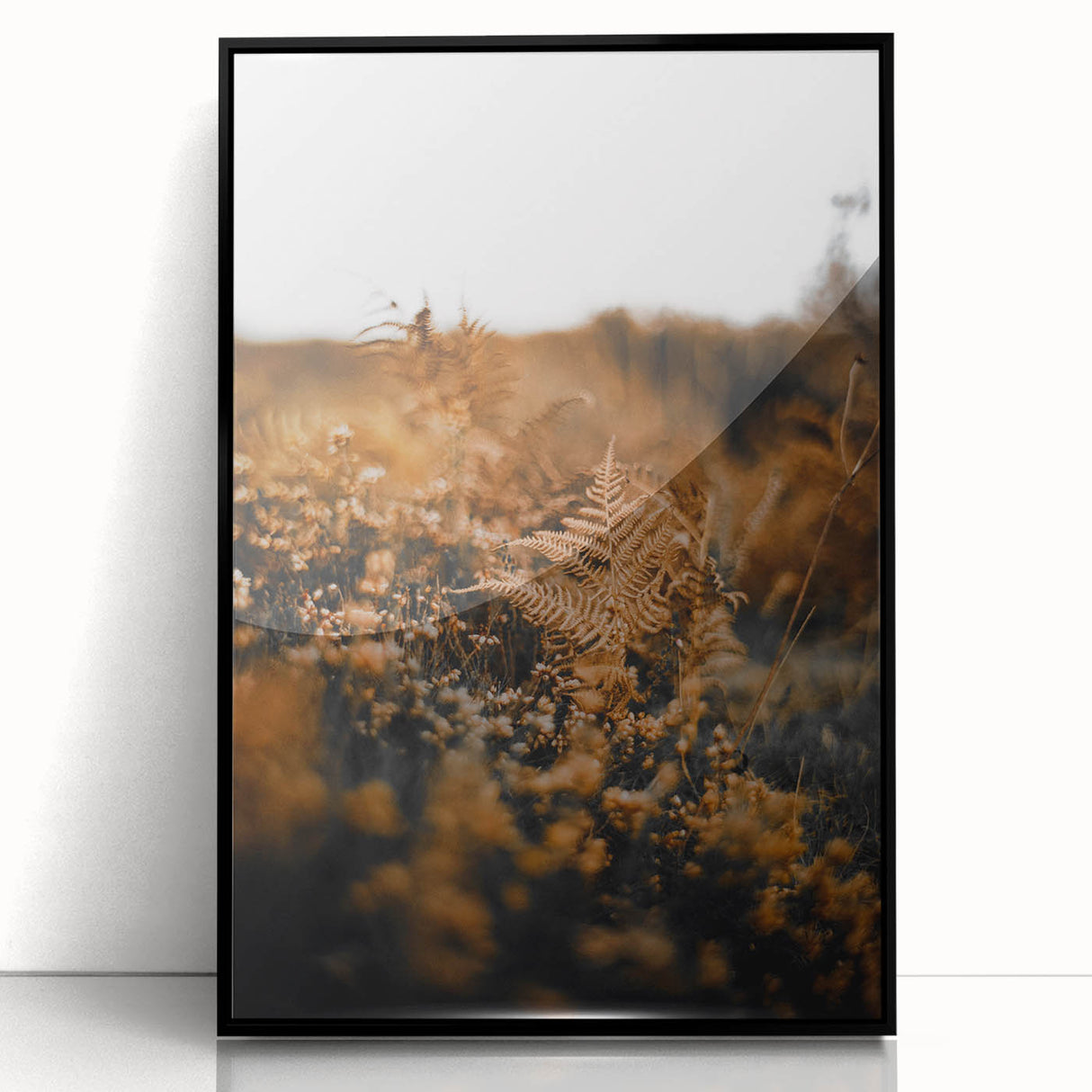 Large abstract wall art depicting autumnal trees in orange and red tones on a black acrylic framed canvas.