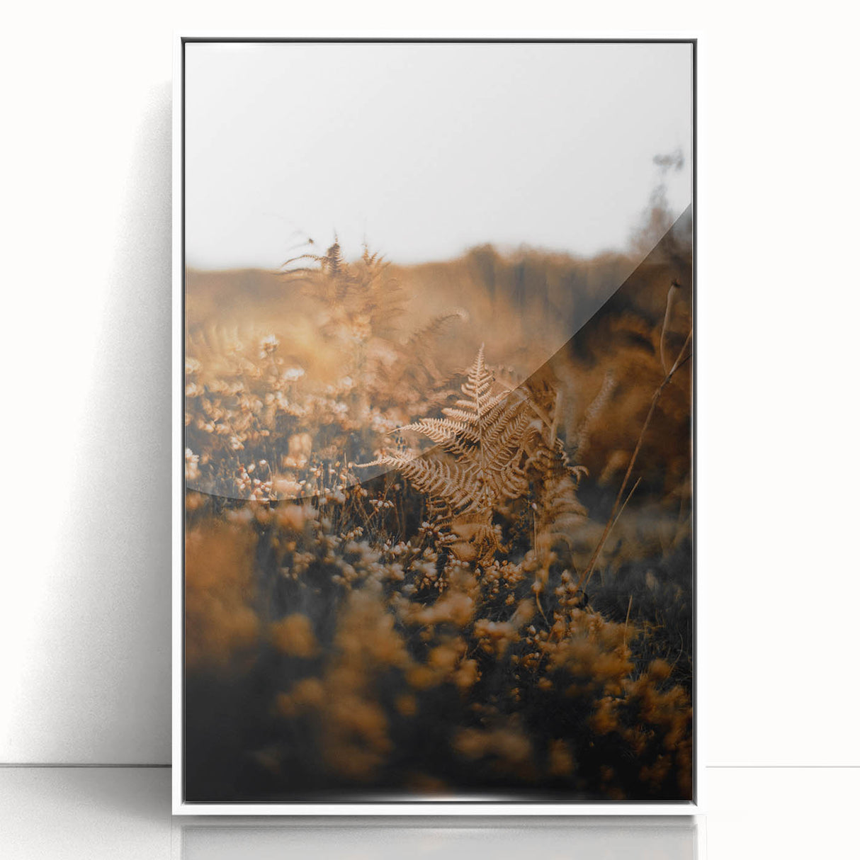 Art deco poster depicting autumn trees in gold and brown tones on a white acrylic framed print.