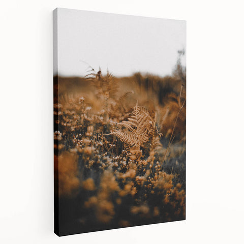 Side view of a large stretched canvas featuring a fall-themed abstract design in warm orange and red tones.