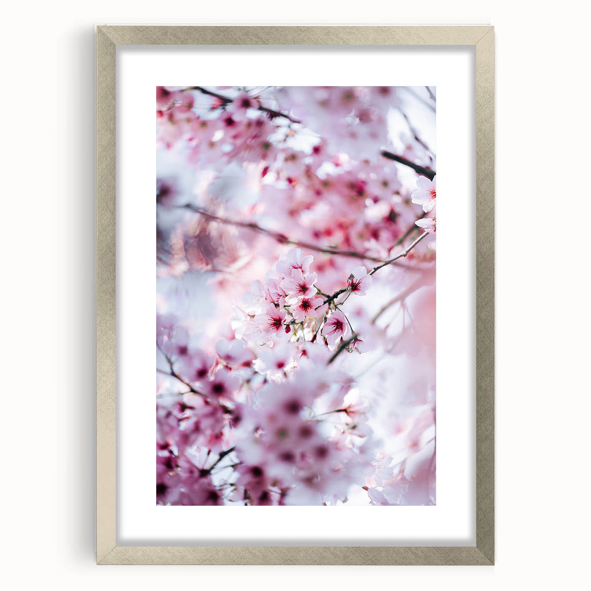 Textured art depicting abstract spring-themed imagery in soft green and yellow tones, framed in silver.