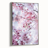 Framed canvas landscape art painting depicting a spring scene with colorful flowers against a black background.