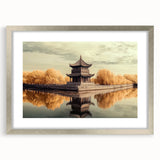 Elegant silver-framed landscape artwork featuring a serene castle scene, presented with a white mat, ideal for enhancing home decor and interior design aesthetics.
