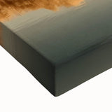 Close-up of a stretched canvas depicting a vibrant landscape featuring a medieval castle surrounded by lush greenery and a clear blue sky, ideal for home decor.