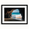 Framed landscape artwork depicting a serene cave scene, featuring a black mat and elegant frame, perfect for enhancing home decor with nature-inspired aesthetics.