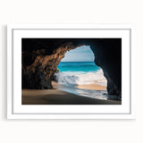 Framed landscape artwork depicting a serene cave scene, featuring natural earthy tones and a white mat. Ideal for home decor, creating a calming atmosphere.