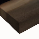 Close-up of a stretched canvas artwork depicting a vibrant landscape with caves, showcasing intricate details in earthy tones, perfect for home decor.