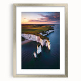 Framed landscape print showcasing dramatic cliffs with a silver mat border, ideal for home decor, adding elegance to any room. Perfect for nature lovers.