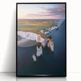 Framed acrylic artwork showcasing a stunning coastal cliff landscape with vibrant colors, elegantly displayed in a sleek black frame, ideal for home decor.