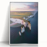Framed acrylic landscape artwork showcasing dramatic cliffs, with a white frame enhancing the vibrant colors, perfect for modern home decor.