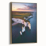 Framed canvas artwork showcasing a stunning landscape with dramatic cliffs, highlighted by a gold frame, perfect for enhancing home decor.