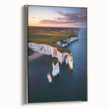Framed canvas artwork depicting dramatic cliffs and serene landscapes, featuring a silver frame that enhances its modern aesthetic, perfect for home decor.