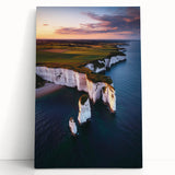 Stretched canvas artwork depicting a dramatic landscape of rugged cliffs and serene ocean waves, showcasing vibrant colors and intricate details, perfect for home decor.