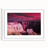 Framed landscape art print showcasing a breathtaking canyon view, featuring a white mat and classic frame, perfect for enhancing home decor and wall aesthetics.