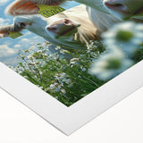 Rolled canvas artwork depicting a serene countryside landscape with vibrant green fields and a blue sky, elegantly packaged in a protective cardboard tube for shipping.