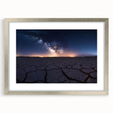 Framed desert landscape artwork in a silver frame with a white mat, showcasing vibrant colors and intricate details, perfect for home decor.