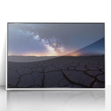 Framed acrylic artwork showcasing a vibrant desert landscape with warm hues of orange and red, set in a sleek white frame, perfect for modern home decor.