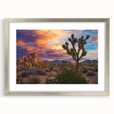 Silver-framed landscape artwork displaying vibrant green fields and a clear blue sky, elegantly matted for a polished finish, perfect for home decor or office branding.