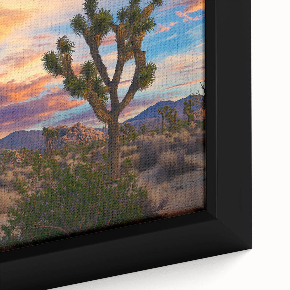 Close-up of a framed canvas print showcasing a vibrant landscape of rolling green fields under a clear blue sky, perfect for home decor and nature enthusiasts.