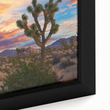 Close-up of a framed canvas print showcasing a vibrant landscape of rolling green fields under a clear blue sky, perfect for home decor and nature enthusiasts.