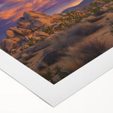 Vibrant rolled canvas artwork depicting serene green landscapes with rolling hills and a clear blue sky, elegantly packaged in a protective cardboard tube for safe shipping.