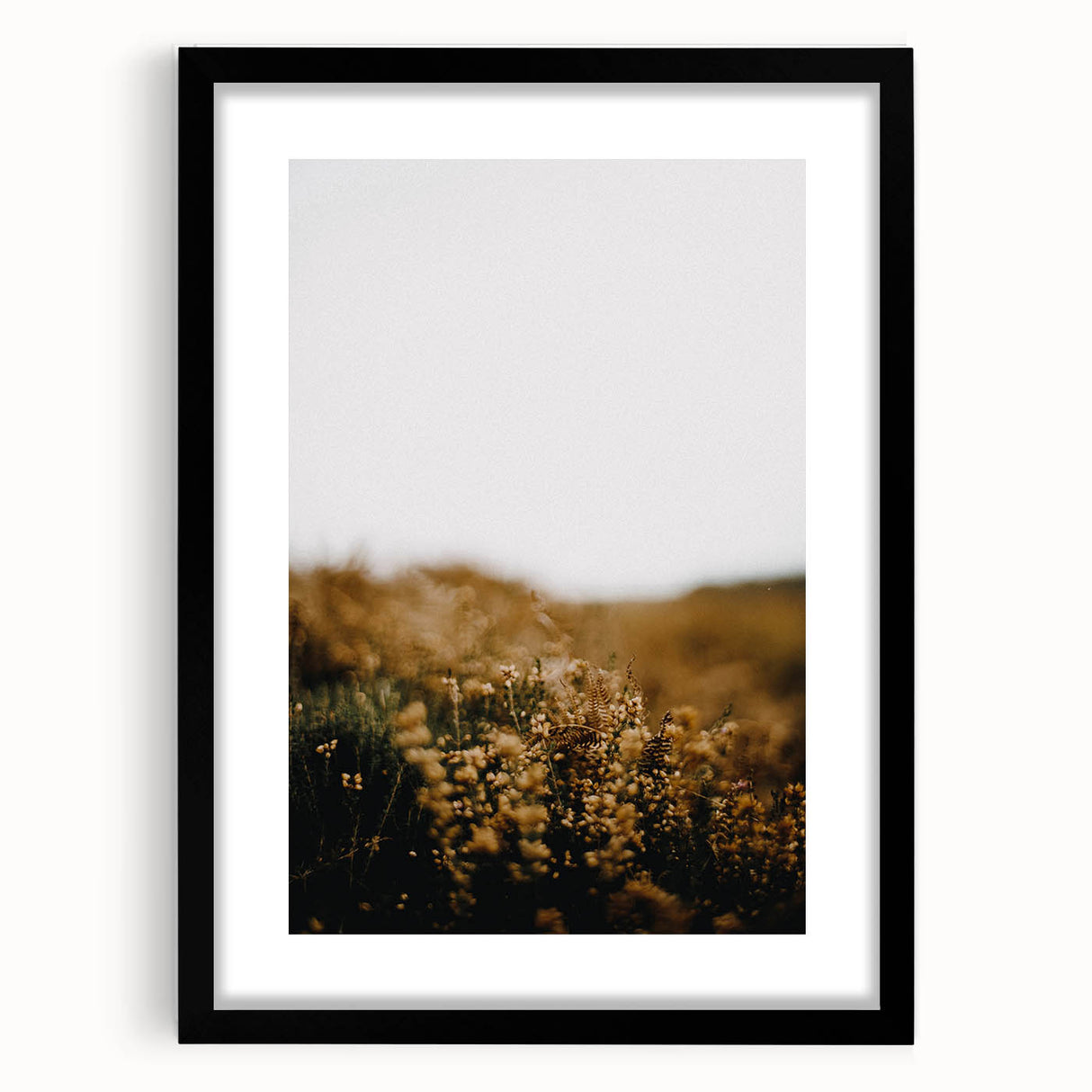 Abstract art print featuring vibrant autumn hues on a textured canvas, framed in black, suitable for large living room walls.