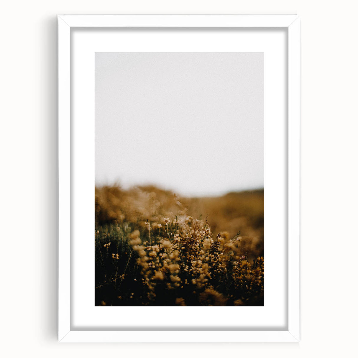 Abstract art print of autumnal trees with orange and yellow hues on a white framed canvas, suitable for dining room decor.