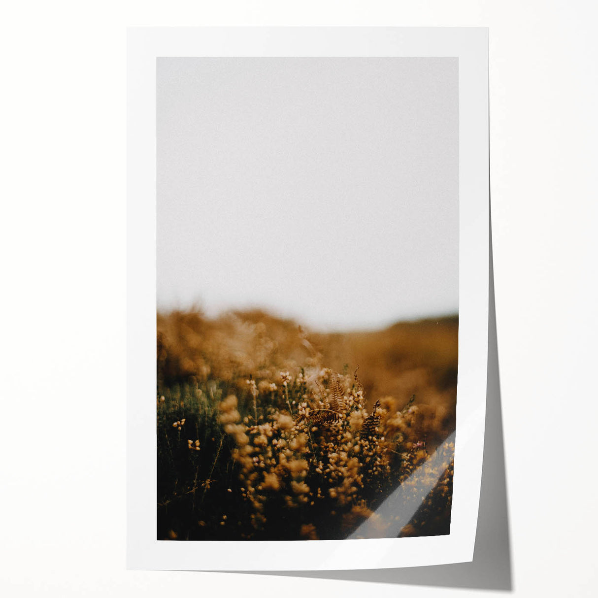Rolled print of a fall-themed floral art with warm orange and red tones, suitable for dining room decor.