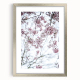 Textured abstract art print in soft green and yellow hues, framed in silver, ideal for bedroom ambiance.