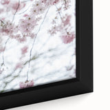 Framed canvas featuring textured, colorful art depicting spring themes on a black background.