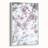 Vintage poster art of spring season on framed canvas, featuring colorful floral design against a black background.