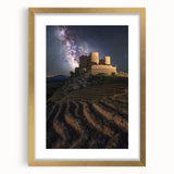 Elegant gold-framed landscape artwork depicting a serene castle scene, complete with a white mat that enhances its luxurious appeal, ideal for home decor.