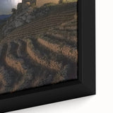 Close-up of a beautifully framed canvas artwork depicting a serene landscape with a majestic castle, showcasing vibrant colors and intricate details, perfect for home decor.