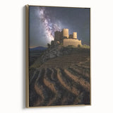 Framed canvas artwork depicting a picturesque landscape with a majestic castle, set against a vibrant blue sky, featuring a luxurious gold frame that enhances its elegance.