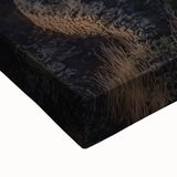 Close-up of a stretched canvas artwork depicting a vibrant landscape with a majestic castle, featuring rich colors and intricate details, perfect for home decor.