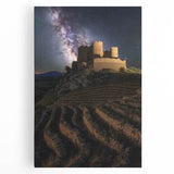 Stretched canvas artwork depicting a serene landscape featuring a majestic castle surrounded by lush greenery and a clear blue sky, perfect for home decor.
