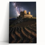 Stretched canvas artwork depicting a serene landscape with a majestic castle surrounded by lush greenery and vibrant blue skies, perfect for home decor.