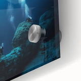 Close-up of vibrant acrylic glass artwork depicting abstract landscapes and caves, showcasing intricate textures and colors, perfect for modern decor.